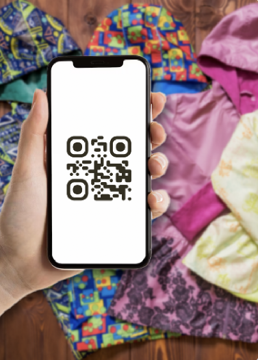 A phone scanning a QR label on clothing